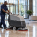 A floor care machine polishing a clean commercial corridor.